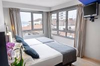 Postel nebo postele na pokoji v ubytování Hotel Faranda Pathos Gijón, Ascend Hotel Collection