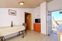 Televízia a/alebo spoločenská miestnosť v ubytovaní Apartments Nada