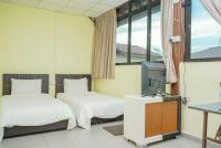 LABIS SUNRISE FARM STAYにあるベッド