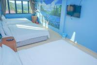 LABIS SUNRISE FARM STAYにあるベッド