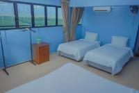 LABIS SUNRISE FARM STAYにあるベッド
