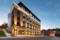 eine Darstellung eines Gebäudes in einer Straße in der Unterkunft Riverbend Hotel and Suites, Trademark Collection by Wyndham in Ashtabula