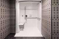 Ein Badezimmer in der Unterkunft Riverbend Hotel and Suites, Trademark Collection by Wyndham