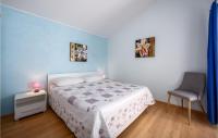 Łóżko lub łóżka w pokoju w obiekcie Three-Bedroom Holiday Home In Kmacici