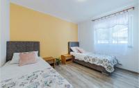 Postel nebo postele na pokoji v ubytování Holiday Home Betiga Betiga