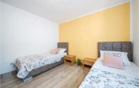 Postel nebo postele na pokoji v ubytování Holiday Home Betiga Betiga