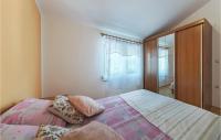 Postel nebo postele na pokoji v ubytování Holiday Home Betiga Betiga