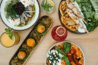 Una mesa con varios platos de comida encima. en Slow Tatry Boutique Resort&SPA, en Zakopane