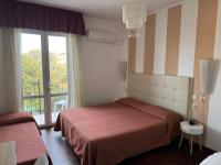 Postel nebo postele na pokoji v ubytování Hotel Le Focette