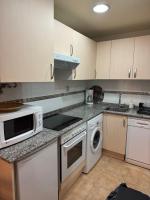 Kuchyň nebo kuchyňský kout v ubytování Moderno apartamento a pie de pista en la Estación de San Isidro