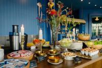 a table topped with lots of food on top at The Sea-Cret Garden Hua Hin in Hua Hin