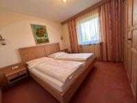 Łóżko lub łóżka w pokoju w obiekcie Chalet Josi