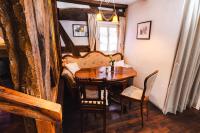 a dining room with a table and a couch at Gasthaus Fiester Hannes in Burbach