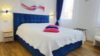 Posteľ alebo postele v izbe v ubytovaní Ca' Monica Apartment