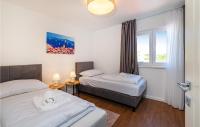 Posteľ alebo postele v izbe v ubytovaní Cozy Home In Privlaka