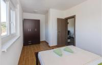 Posteľ alebo postele v izbe v ubytovaní Two-Bedroom Apartment Saldun With Sea View 08