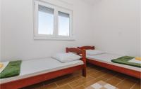 Posteľ alebo postele v izbe v ubytovaní Two-Bedroom Apartment Saldun With Sea View 08
