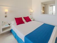 Postel nebo postele na pokoji v ubytování Hotel La Santa Maria