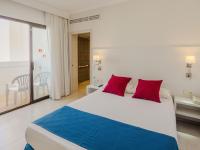 Postel nebo postele na pokoji v ubytování Hotel La Santa Maria