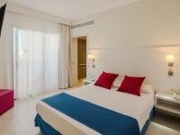 Postel nebo postele na pokoji v ubytování Hotel La Santa Maria