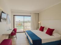 Postel nebo postele na pokoji v ubytování Hotel La Santa Maria