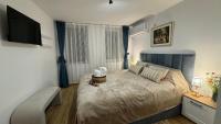 Postel nebo postele na pokoji v ubytování Apartment Tsarevets View