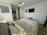 TV a/nebo společenská místnost v ubytování Apartment Tsarevets View