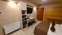 A bed or beds in a room at Hotel Lenotel