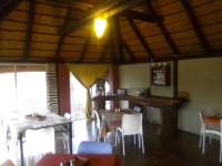 a dining room with tables and chairs in a building at Hais Ra Tented Campsite in Khorixas