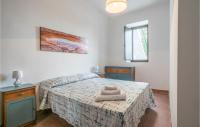 A bed or beds in a room at Nice Home In Modica With Wifi