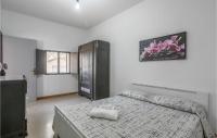 A bed or beds in a room at Nice Home In Modica With Wifi