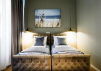 Łóżko lub łóżka w pokoju w obiekcie Vayalen Boutique Hotel