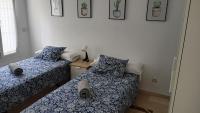 Piso Centrico 1.5km Playa con gran terraza +vistasにあるベッド