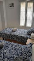 Piso Centrico 1.5km Playa con gran terraza +vistasにあるベッド