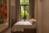 A bed or beds in a room at Vmaison Brera Milano