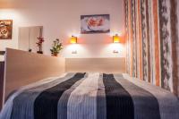 Posteľ alebo postele v izbe v ubytovaní All In Apartman
