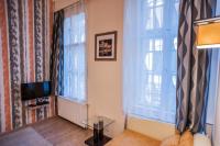 Televízia a/alebo spoločenská miestnosť v ubytovaní All In Apartman