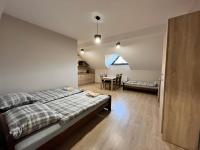 Łóżko lub łóżka w pokoju w obiekcie Apartamenty Na Rozstaju