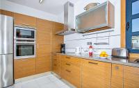 A kitchen or kitchenette at Nice Home In Playa Blanca With Sauna