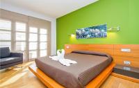 A bed or beds in a room at Nice Home In Playa Blanca With Sauna