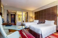 ヒルトン バンコク グランデ アソーク - Hilton Bangkok Grande Asokeにあるベッド