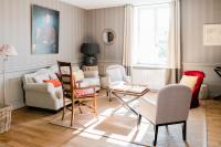 a living room with chairs and a table at Château de Pierreclos in Pierreclos
