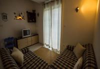 Televízia a/alebo spoločenská miestnosť v ubytovaní Apartments Daju