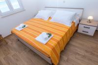 Łóżko lub łóżka w pokoju w obiekcie Apartments Zvone1