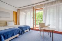 Posteľ alebo postele v izbe v ubytovaní Hotel Dom Zdrojowy Resort & SPA - Destigo Hotels