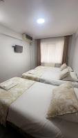 A bed or beds in a room at Amore Hotel Istanbul