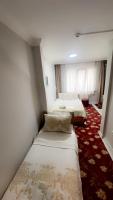 A bed or beds in a room at Amore Hotel Istanbul