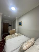 A bed or beds in a room at Amore Hotel Istanbul