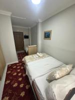 A bed or beds in a room at Amore Hotel Istanbul