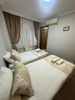 A bed or beds in a room at Amore Hotel Istanbul